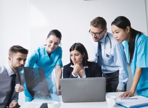 medical-team-examining-x-ray-report